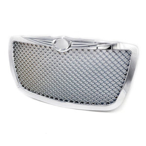 A silver grill with a black mesh on top of it.
